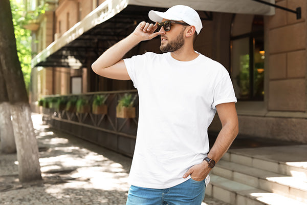 Young man wearing white t-shirt on street